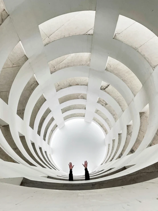 a couple of people that are standing in a room, inspired by Zha Shibiao, unsplash contest winner, brutalism, white spiral horns, wide high angle view, islamic architecture, white marble interior photograph