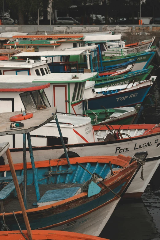 a bunch of boats that are sitting in the water, brazil, graphic print, multicolored, color photograph