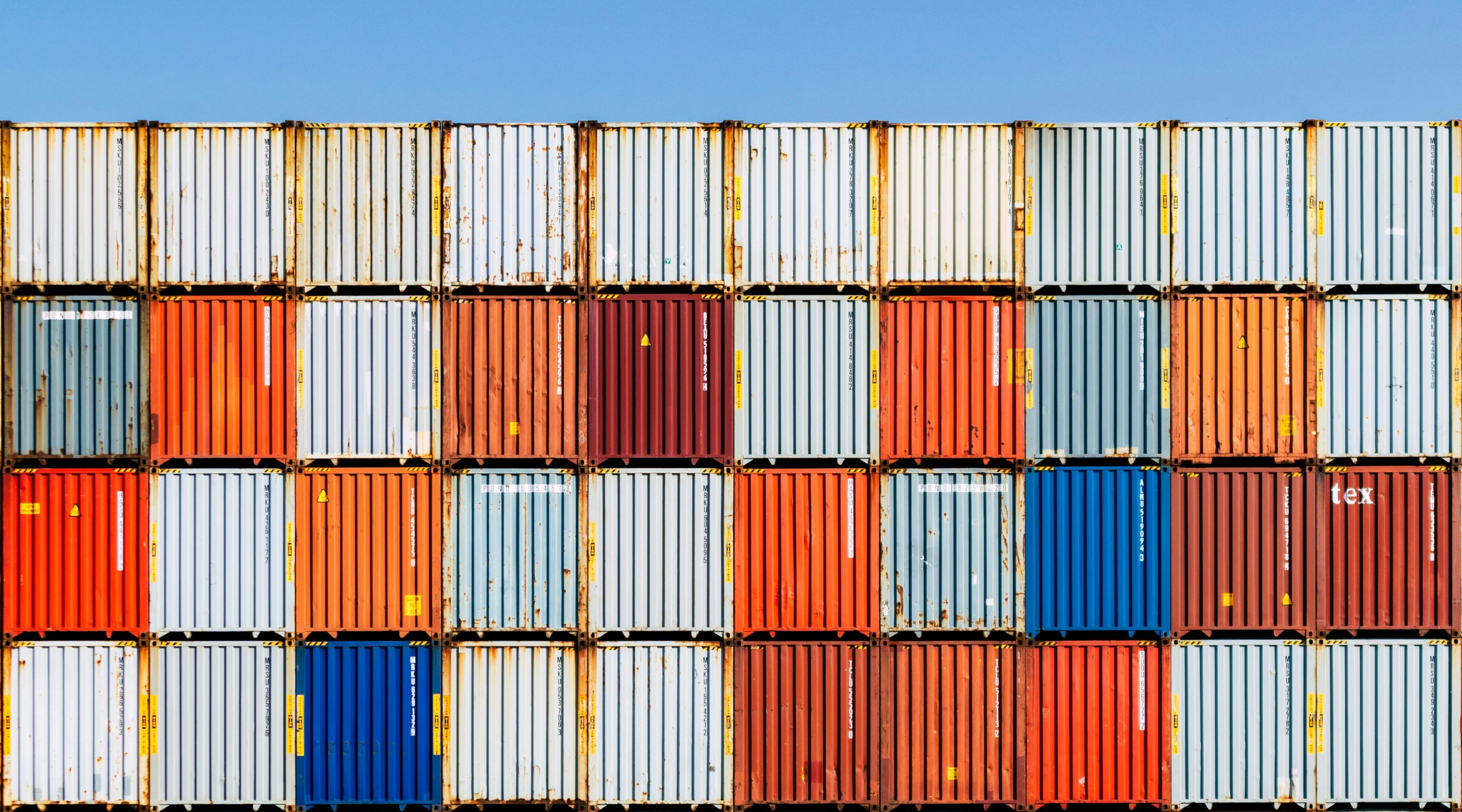 a stack of containers stacked on top of each other, unsplash, square lines, multi colour, gold, blue