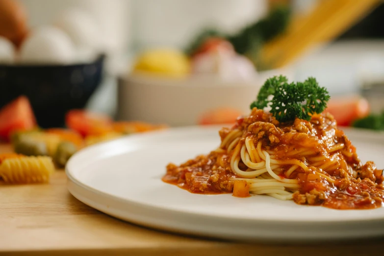 a close up of a plate of food on a table, spaghetti, profile image, local foods, daily specials