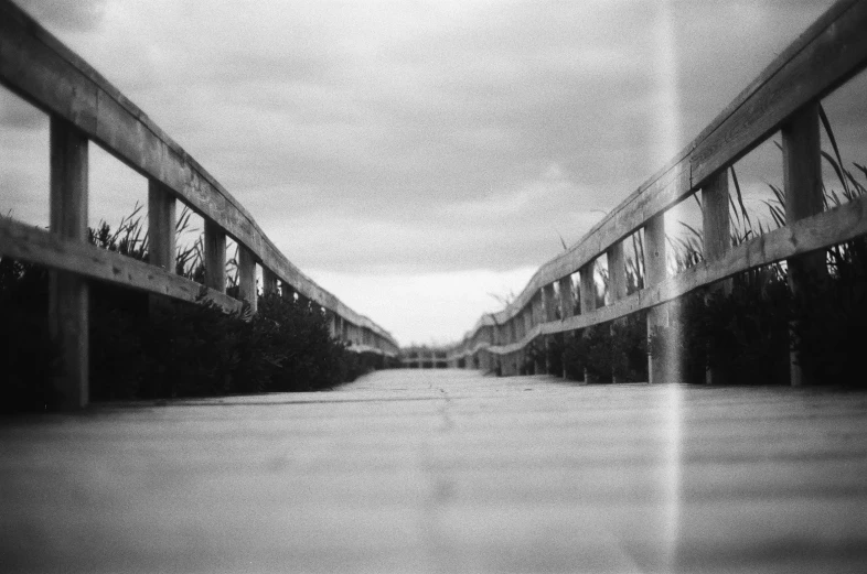 a black and white photo of a bridge, by Altichiero, holga hasselblad, pripyat, empty streets, low quality instant camera photo