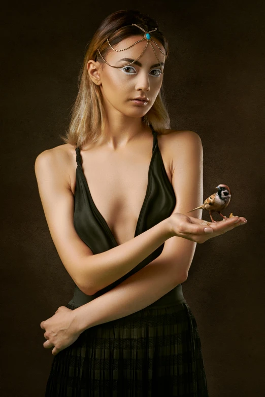 a woman in a black dress holding a small bird, a photorealistic painting, inspired by Carlo Mense, trending on cgsociety, model with attractive body, black and brown, wearing a camisole, concept photoset