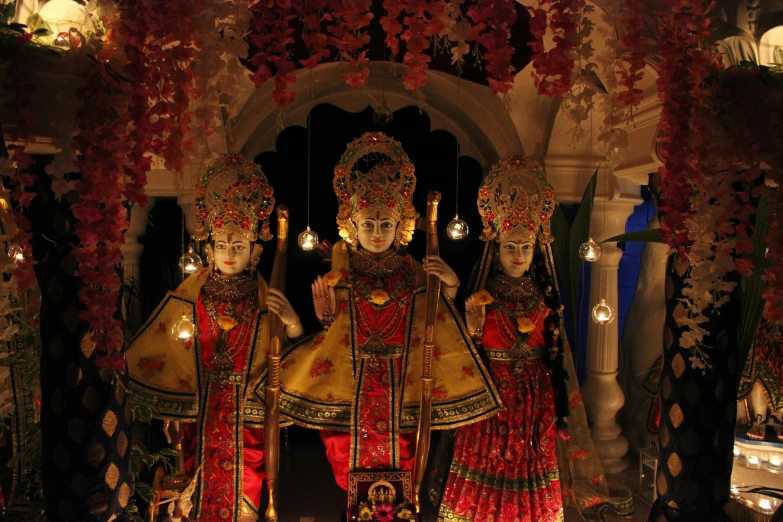 a couple of statues sitting next to each other, a statue, by Gwen Barnard, qajar art, standing in a hindu kovil, dramtically lit, avatar image, the three marys at the sepulchre