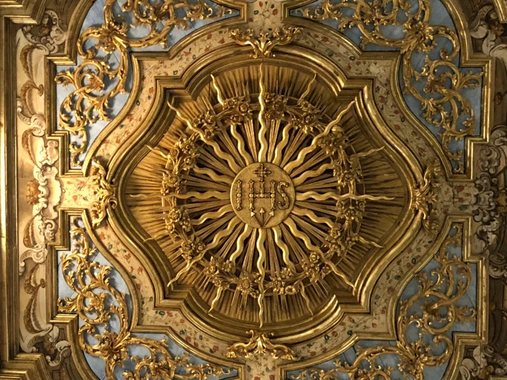 a close up of a gold and blue ceiling, an album cover, pinterest, baroque, sun shining, holy halo, 3 4 5 3 1, in hoc signo vinces