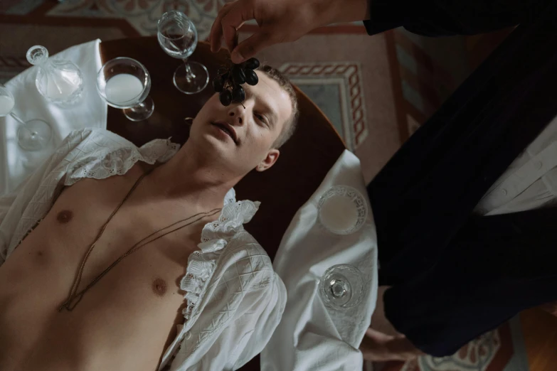 a shirtless man laying on top of a bed, an album cover, inspired by Konstantin Somov, renaissance, still from loki ( 2 0 2 1 ), apothecary, serge marshennikov, [ theatrical ]