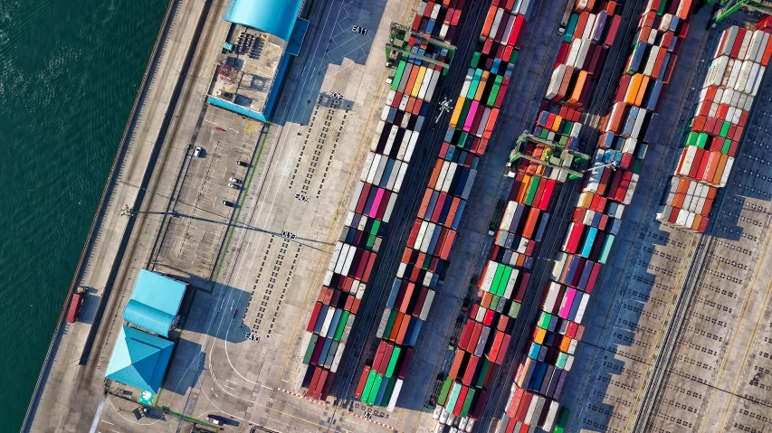 a large group of containers sitting on top of a body of water, pexels contest winner, figuration libre, birds eye view, inspect in inventory image, various colors, terminals