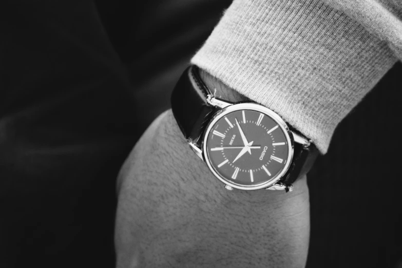 a close up of a person wearing a watch, a black and white photo, by Kristian Zahrtmann, pexels, realistic », well - dressed, advertising photo, fossil