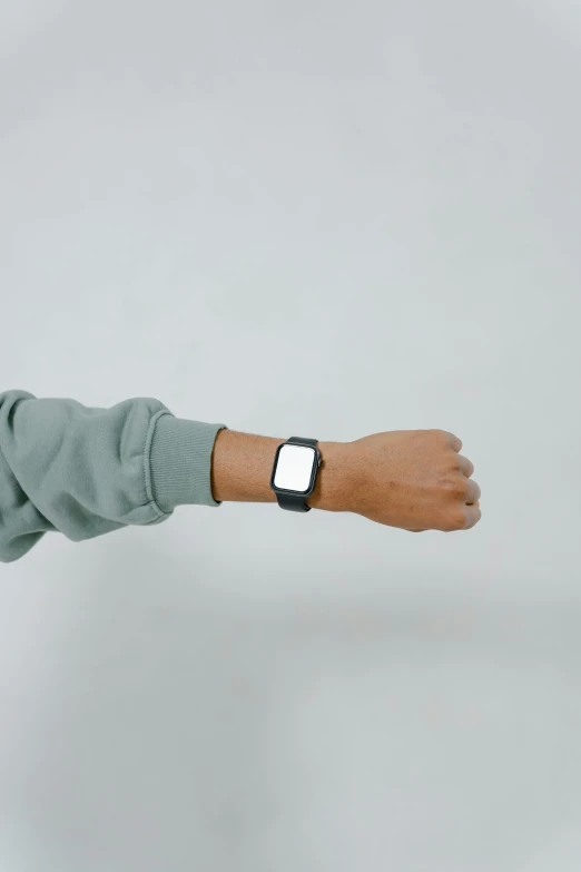 a close up of a person wearing a watch, a cartoon, trending on unsplash, plain background, wearing a black sweater, rectangle, low quality photo