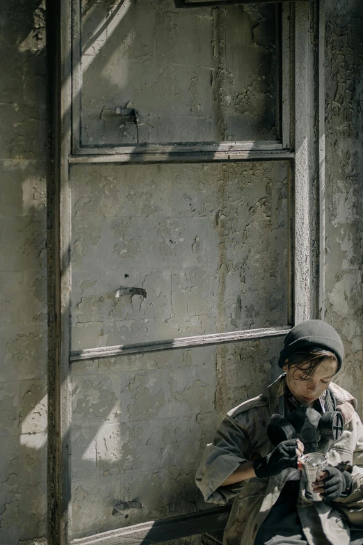 a person sitting on the ground with a stuffed animal, by Elsa Bleda, unsplash contest winner, graffiti, vietnam door gunner, boy staring at the window, war in ukraine, 8 k movie still