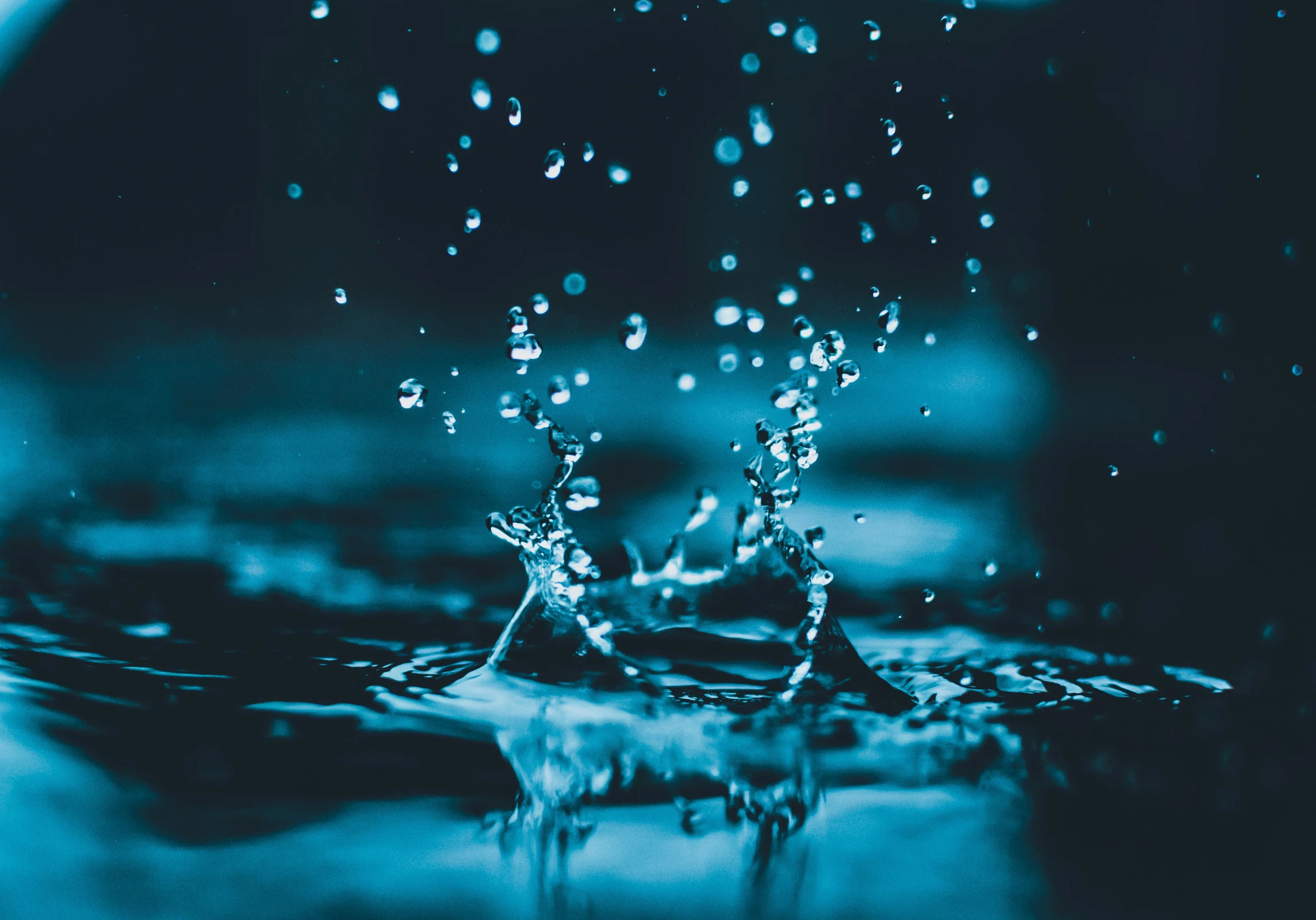 a splash of water on top of a blue surface, an album cover, pexels contest winner, visual art, raining at night, hydration, intricate water, background image