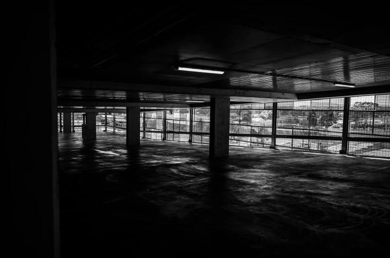 a black and white photo of an empty parking garage, unsplash, vibrant dark mood, square, black and white artistic photo, artwork empty daylight