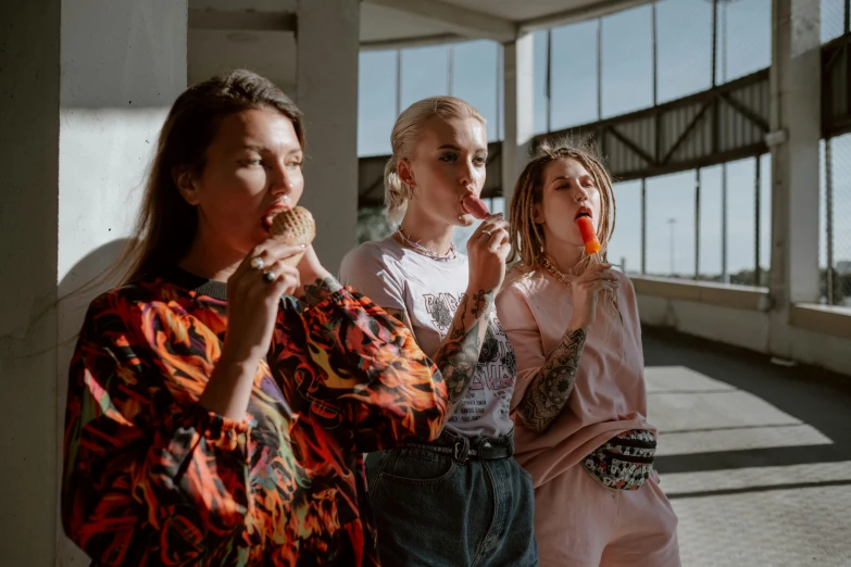 a group of women standing next to each other, a picture, by Emma Andijewska, pexels contest winner, eating ice cream, outlive streetwear collection, lipstick, women playing guitar