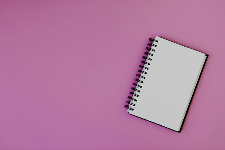 a notepad sitting on top of a pink surface, by Robbie Trevino, pexels, white and purple, black-and-white, background image, floating in empty space