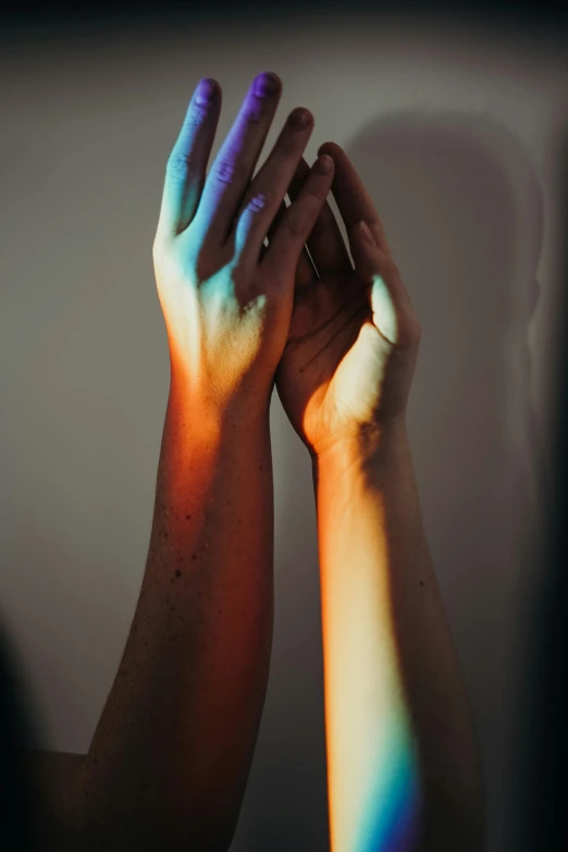 a close up of a person holding a cell phone, inspired by Elsa Bleda, aestheticism, holding each other hands, rainbow lighting, profile image, indoor picture