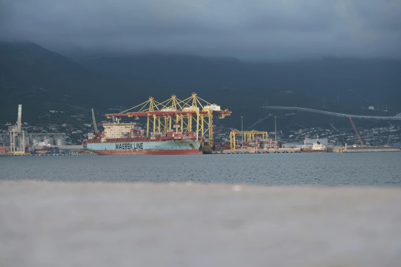 a large cargo ship sitting on top of a body of water, wellington, avatar image, cinematic image