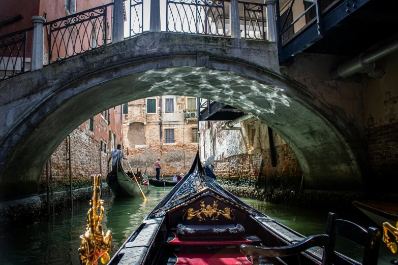 a gondola going under a bridge on a canal, by Canaletto, pexels contest winner, sunlight glistening, thumbnail, inside a grand, parce sepulto