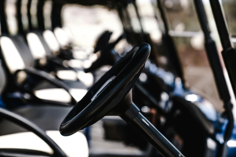 a close up of a steering wheel on a golf cart, a portrait, unsplash, multiple stories, in a row, thumbnail, profile image