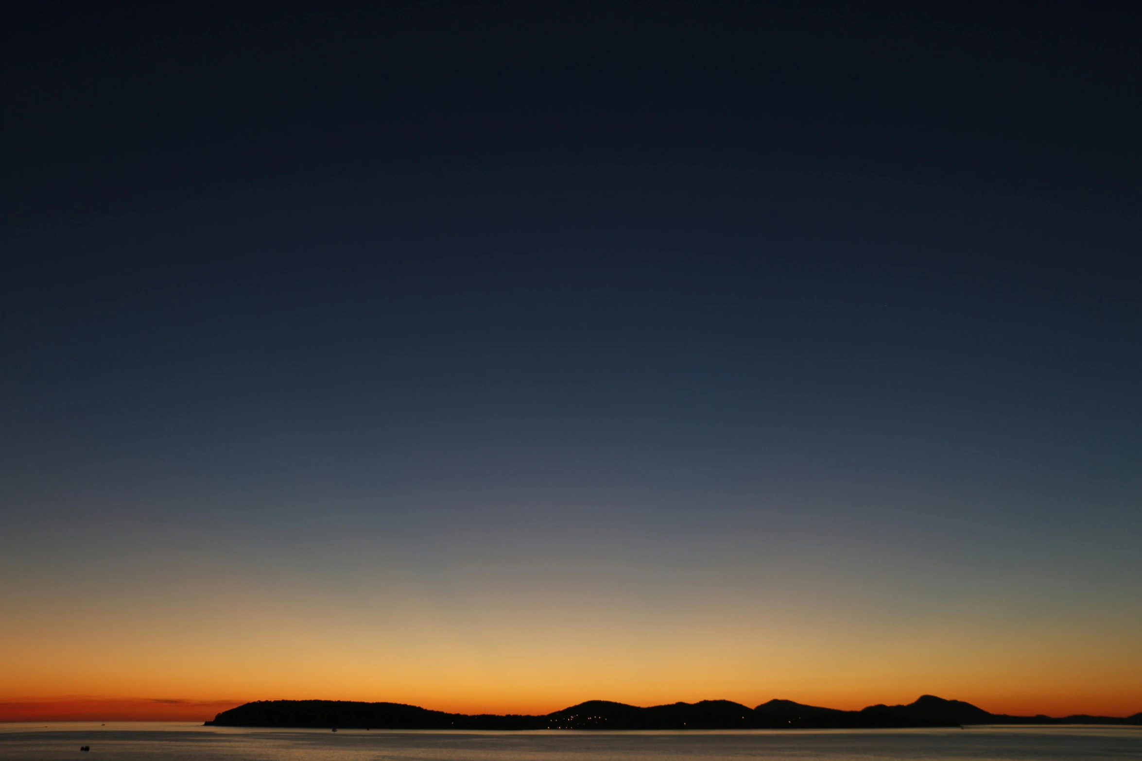 the sun is setting over a body of water, by Doug Ohlson, minimalism, night time photograph, dark blue + dark orange, cloudless-crear-sky, color ( sony a 7 r iv