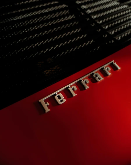a close up of the emblem on a red car, inspired by Bernardo Cavallino, unsplash, 8k portrait render, sleek spines, studio product shot, medium format