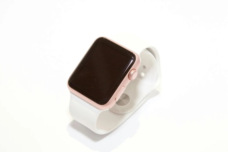 an apple watch sitting on top of a white stand, pink and gold, white plastic, unedited, w 1 9 2 0