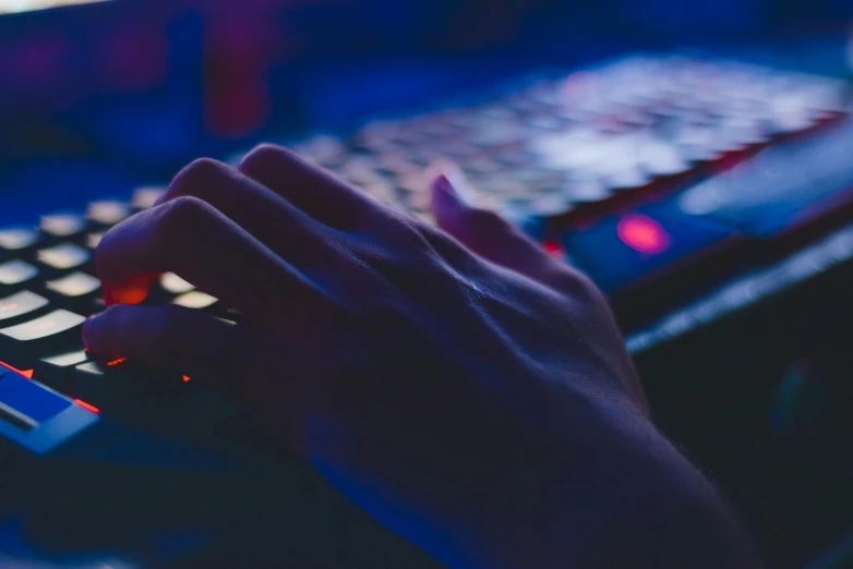 a close up of a person typing on a keyboard, a picture, inspired by Elsa Bleda, computer art, blue and red lighting, game resources, instagram post, background image