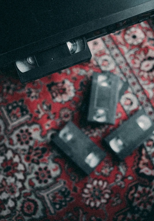 a laptop computer sitting on top of a red carpet, an album cover, unsplash contest winner, visual art, persian rugs, vintage transistors, cassette, alessio albi