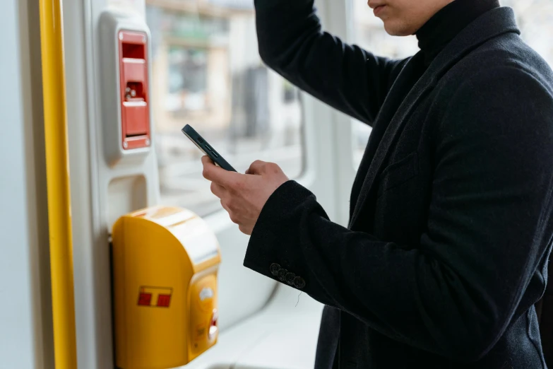 a man is looking at his cell phone, les automatistes, faked service ticket, avatar image, unsplash contest winning photo, orange line