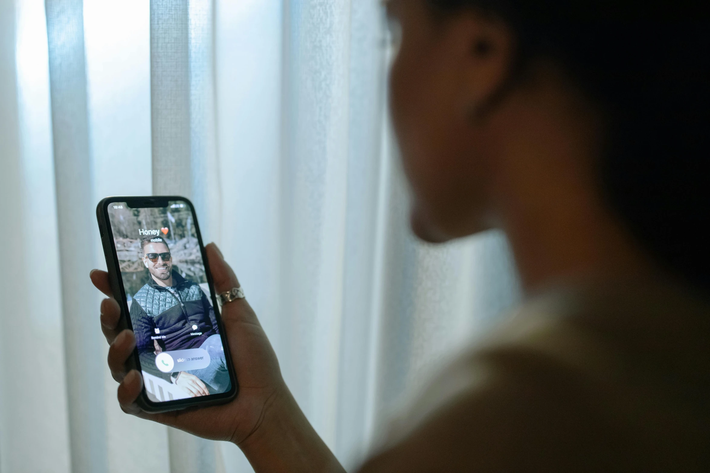 a woman taking a picture of herself on her cell phone, a picture, shot on alexa, joel torres, close up to the screen, long distance photo