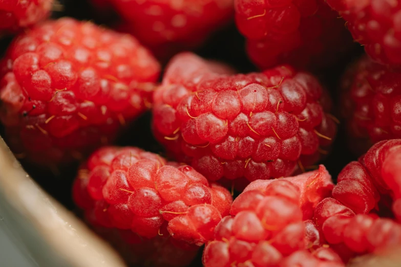 a close up of a bunch of raspberries, by Adam Marczyński, pexels, award - winning crisp details ”, 🦩🪐🐞👩🏻🦳, handcrafted, thumbnail