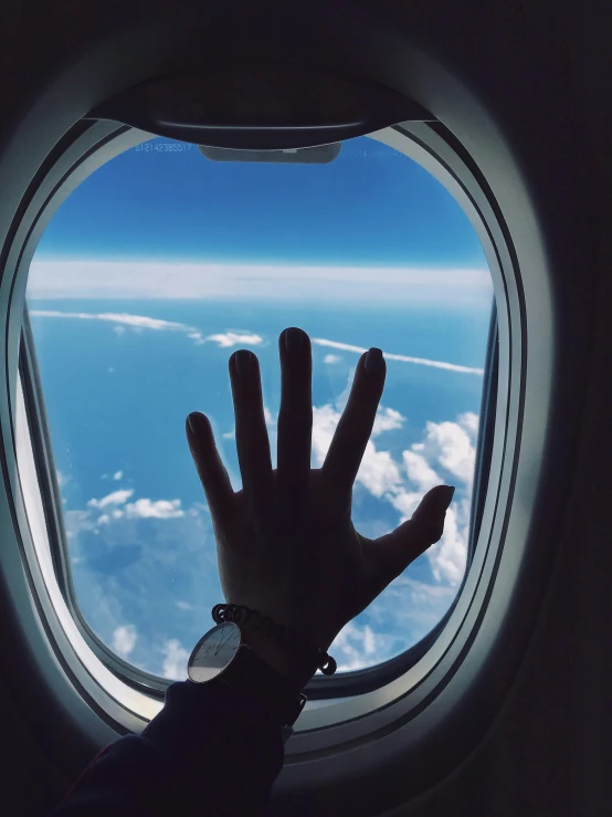 a hand reaching out of an airplane window, pexels contest winner, holding a 🛡 and an 🪓, ✨🕌🌙, profile image, hand with five fingers