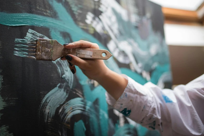 a woman is painting on a wall with a brush, a photorealistic painting, by Julia Pishtar, pexels contest winner, action painting, photography of charline von heyl, intricate oil details, on a canva, complex and intricate