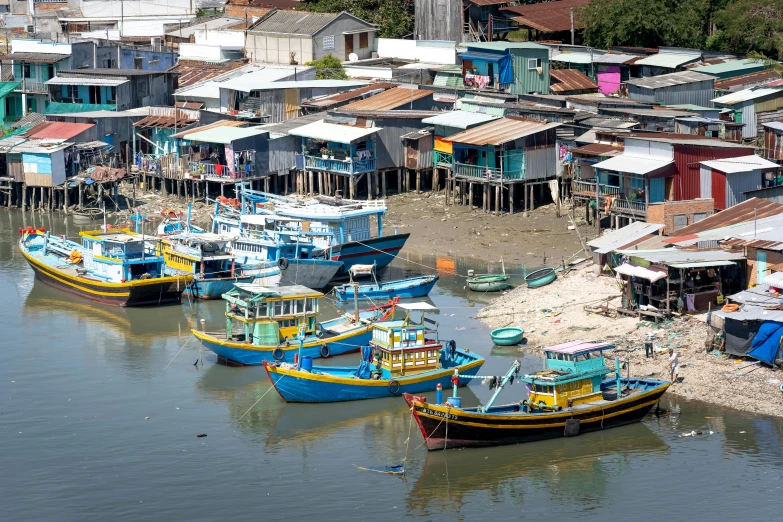 a group of boats sitting on top of a body of water, by Basuki Abdullah, pexels contest winner, dau-al-set, shanty townships, avatar image, zoomed out view, cambodia