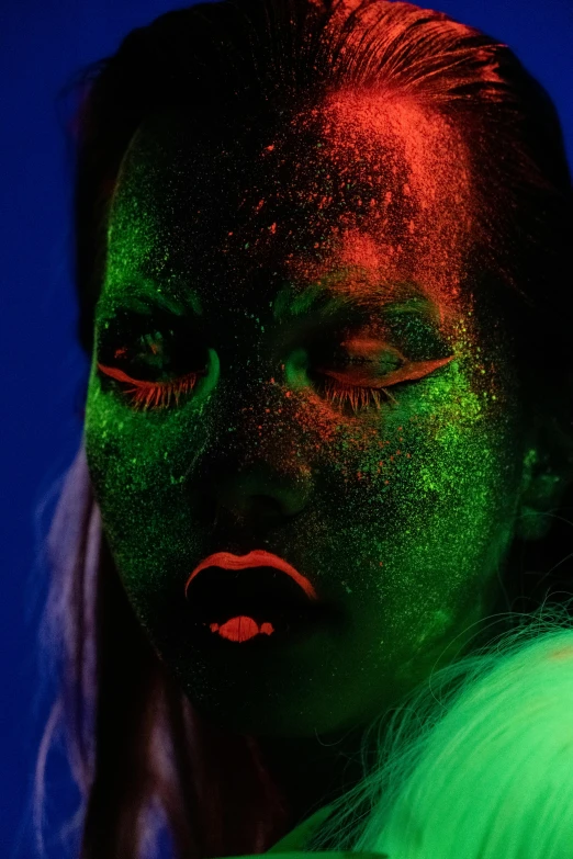 a woman with green paint on her face, an album cover, inspired by Elsa Bleda, trending on pexels, red and blue neon, made of glowing oil, !!! colored photography, greenish skin