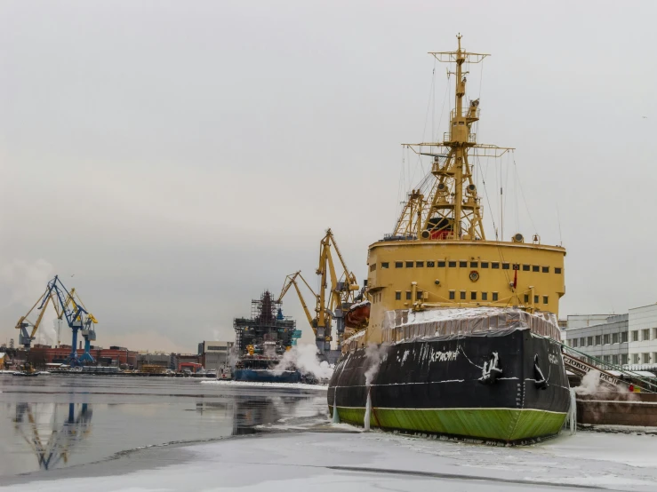 a large boat sitting on top of a body of water, by Sven Erixson, pexels contest winner, cold temperature, shipyard, viktor antonov, seen from outside