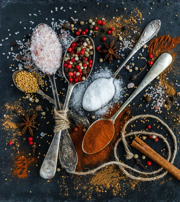 a table topped with spoons filled with different types of spices, a still life, pexels, dau-al-set, square, sugar sprinkled, salt, thumbnail