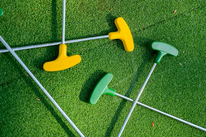 a green and yellow putt putt putt putt putt putt putt putt putt putt putt putt, unsplash, conceptual art, swords stuck in the ground, screwdrivers, 🎨🖌️, thumbnail