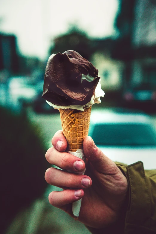 a person holding an ice cream cone in their hand, pexels contest winner, maple syrup & hot fudge, 15081959 21121991 01012000 4k, chocolate. rugged, alessio albi