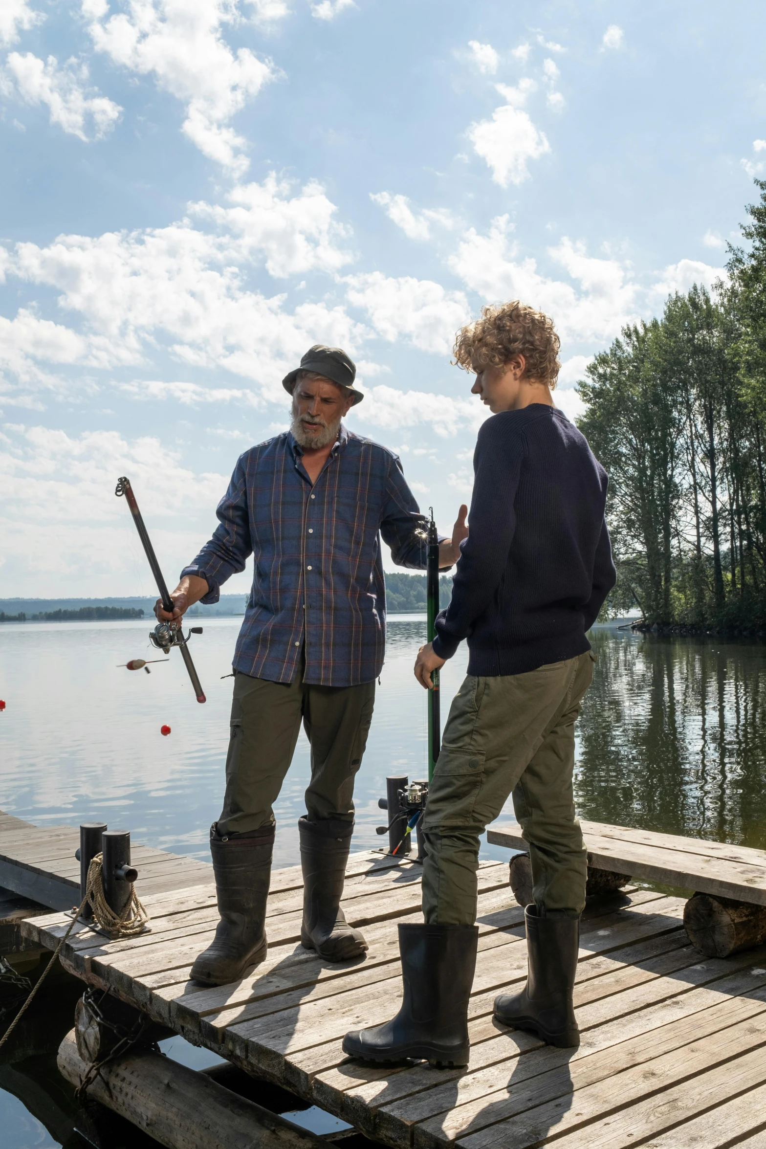 a couple of men standing on top of a wooden dock, speilberg movie, fishing, family friendly, tv show still