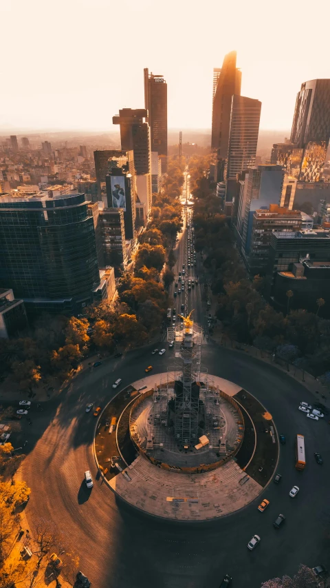 an aerial view of a city at sunset, by Alejandro Obregón, pexels contest winner, brutalist aztec architecture, intersection, holiday season, 15081959 21121991 01012000 4k