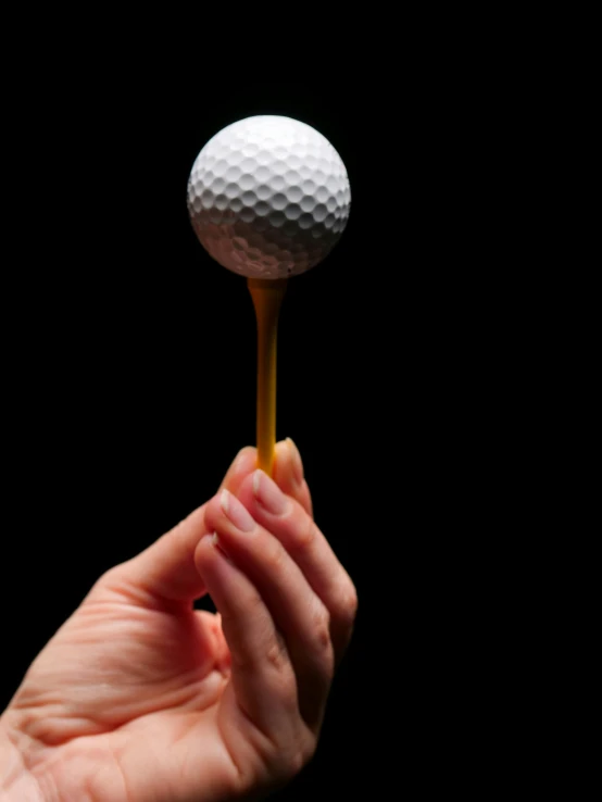 a person holding a golf ball on a tee, precisionism, edible, holding a gold! cane!, thumbnail, large)}]