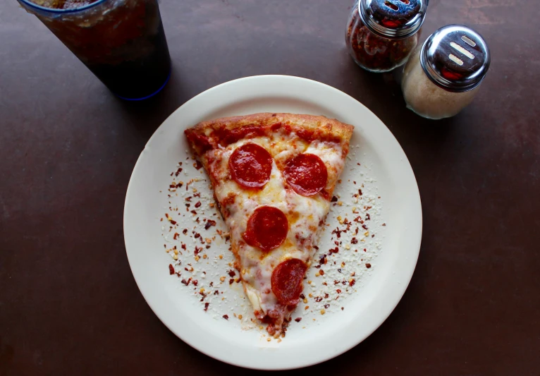 a white plate topped with a slice of pizza, a photo, pexels, maroon, animation, three quarter angle, a tall