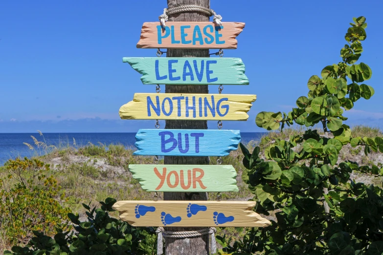 a wooden sign that says please leave nothing but your, by Lynn Pauley, pixabay, south beach colors, avatar image, naturist, poop