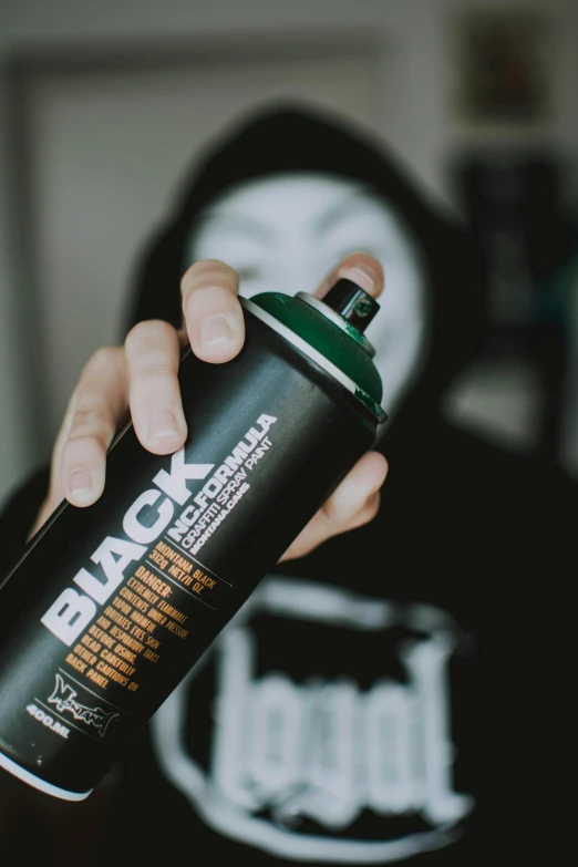 a close up of a person holding a spray can, black supremacy, profile image, designer product, black eyed