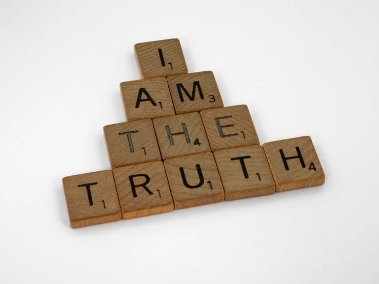 scrabbles spelling i am the truth on a white background, a picture, unsplash, avatar image, brown, 3 4 5 3 1, ealistic