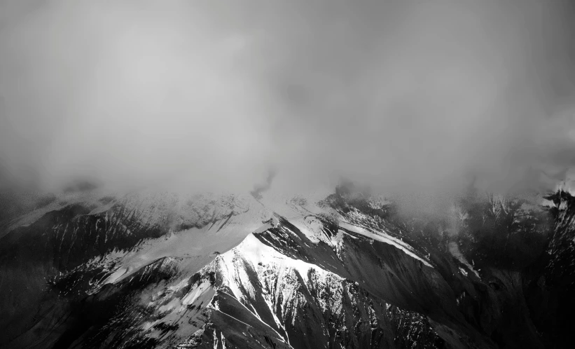 a black and white photo of snow covered mountains, a black and white photo, unsplash contest winner, minimalism, volcano fog, 8k vertical wallpaper, 4 k, dark