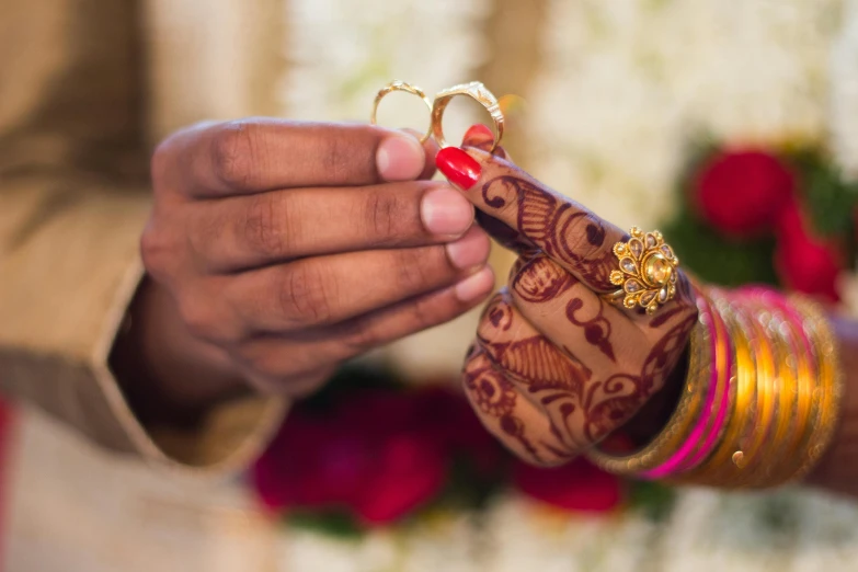 a close up of a person holding a wedding ring, hurufiyya, square, thumbnail, hindu ornaments, awkward