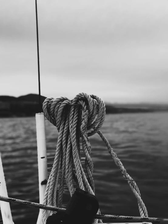 a black and white photo of a rope on a boat, by Christen Dalsgaard, unsplash, shot on iphone, jovana rikalo, skye meaker, kodak tri-x 400