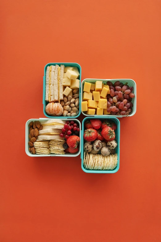 four containers filled with different types of food, a picture, by Alison Geissler, pexels, dau-al-set, teal orange color scheme, (cheese), having a snack, nut