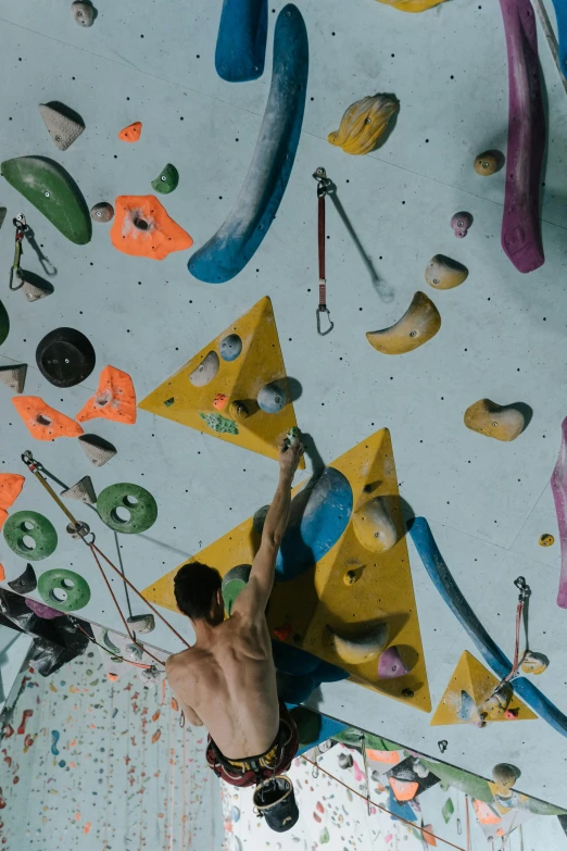 a man climbing up the side of a climbing wall, pexels contest winner, process art, things hanging from ceiling, manuka, overhead view, 15081959 21121991 01012000 4k