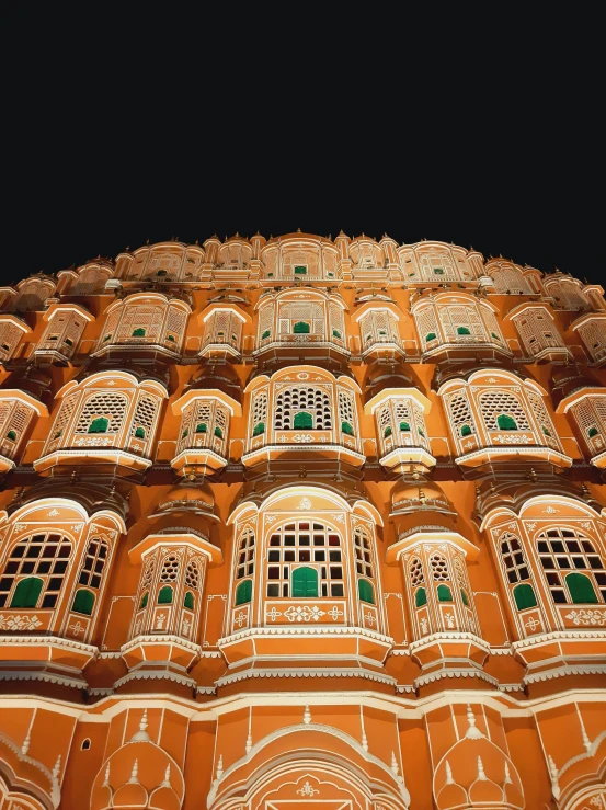 a very tall building with lots of windows, pexels contest winner, renaissance, indian patterns, set at night, shades of gold display naturally, panoramic shot